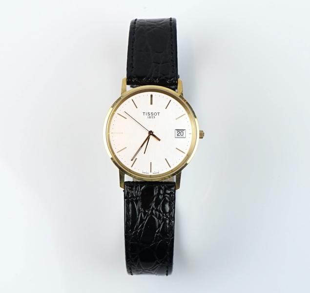 Tissot 1853, herrarmbandsur, guld på stål.