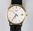 Tissot 1853, herrarmbandsur, guld på stål.