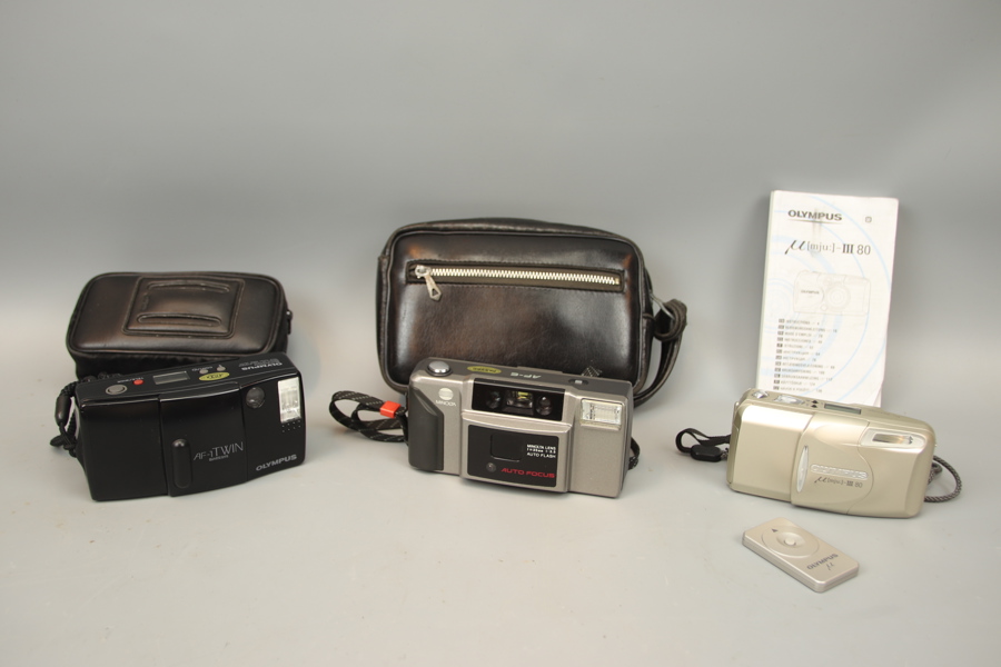 Kameror, 3 st, Olympus och Minolta, bl.a Olympus mju: -III 80 med fjärrkontroll.