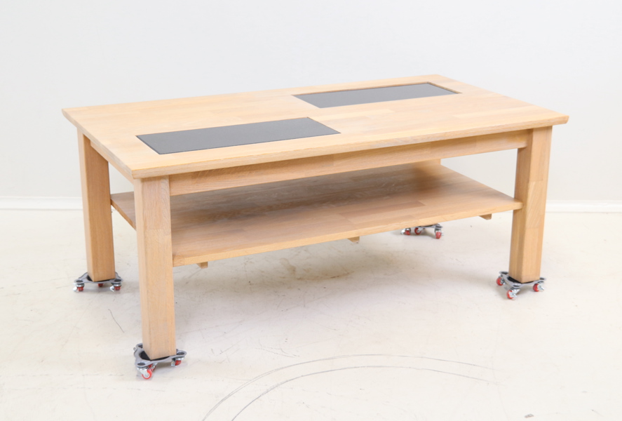 Soffbord, "Ystad", oljad ek, 2 infällda plattor i svart granit, Stenexpo.