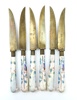 Fruktknivar i ställ, 7 delar, porslin/mässing.