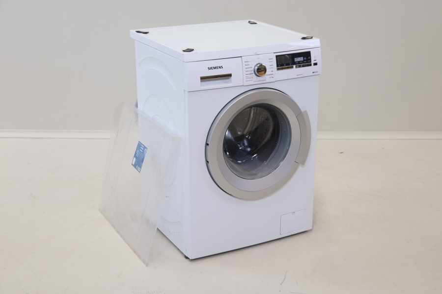 Tvättmaskin, Siemens WM14Q451DN, samt droppskydd.