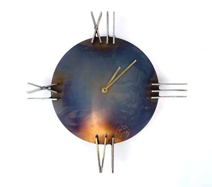 Adam Olsson, väggur, metall, Olsson & Dåm.