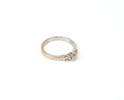 Ring, 18K rhodinerat guld med en brilliantslipad och 4 baguetteslipade diamanter, uppskattat 0,1K.