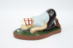 Figurin, golfspelare, keramik.