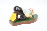 Figurin, golfspelare, keramik.