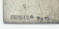 Armring, fingerborg och plakett, silver.