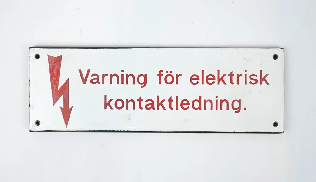 Skylt, ''Varning för elektrisk kontaktledning'', emaljerad plåt.