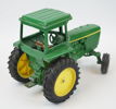 Leksakstraktor med 2 st tillbehör, metall, ''John Deere'', ERTL.