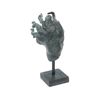 Carl Milles, efter, skulptur, grönpatinerad brons i form av änglahuvud, muséekopia, otydligt stämplad.