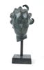 Carl Milles, efter, skulptur, grönpatinerad brons i form av änglahuvud, muséekopia, otydligt stämplad.