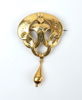 Brosch med droppformad kläpp, 18K guld, 1874.