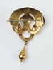 Brosch med droppformad kläpp, 18K guld, 1874.